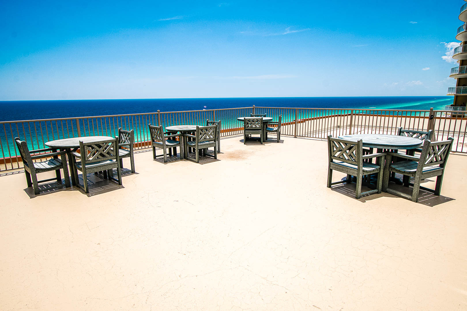 A spacious patio facing the beach at VRI's Landmark Holiday Beach Resort in Panama City, Florida.